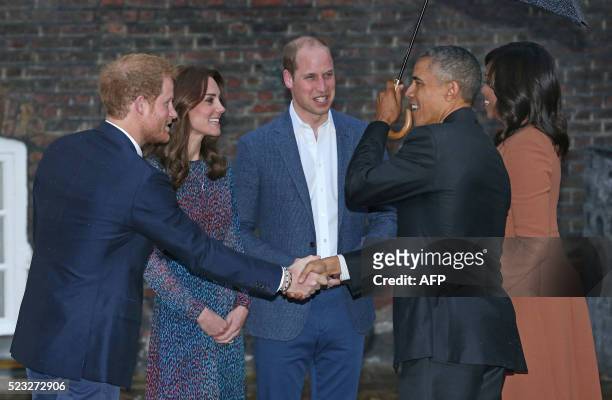 President Barack Obama shakes hands with Britain's Prince Harry as he Prince William, Duke of Cambridge and Catherine Duchess of Cambridge greet the...