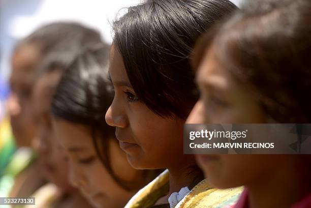 Nahua Pipil indigenous girls take part in the commemoration of the Earth Day in San Salvador on April 22, 2016. Countries around the world annually...