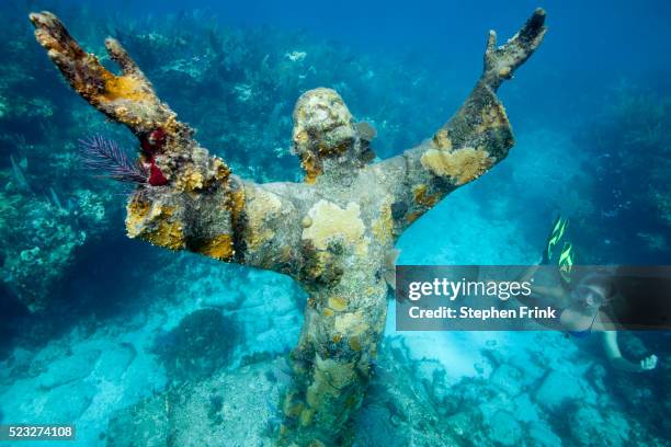 snorkeling the christ statue. - bronze statue stock pictures, royalty-free photos & images