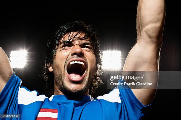 soccer player celebrating - rufen sprache stock-fotos und bilder