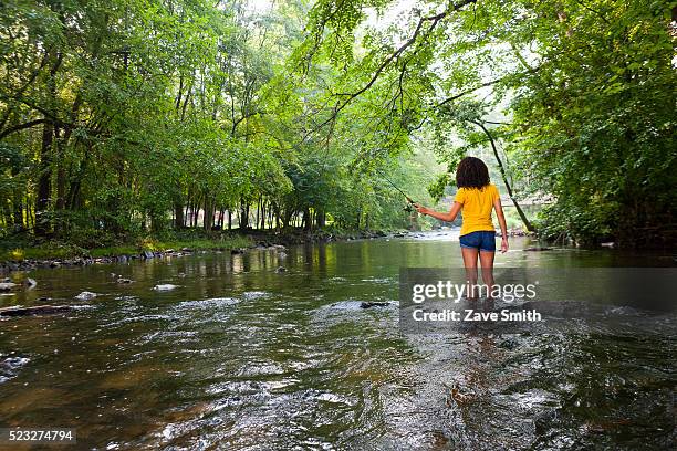 young woman fishing in river, coatesville, pennsylvania, usa - coatesville stock pictures, royalty-free photos & images