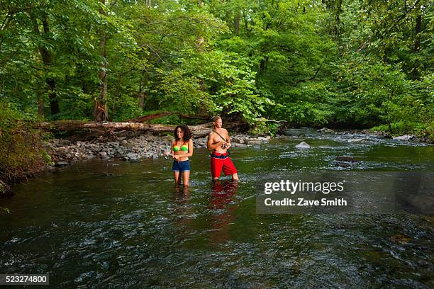 young couple fishing in river, coatesville, pennsylvania, usa - coatesville stock pictures, royalty-free photos & images