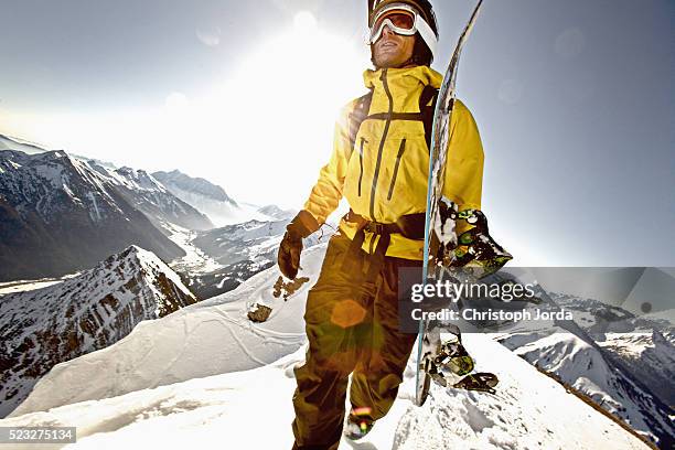 snowboarder on top of mountain, tyrol, austria - snowboard imagens e fotografias de stock