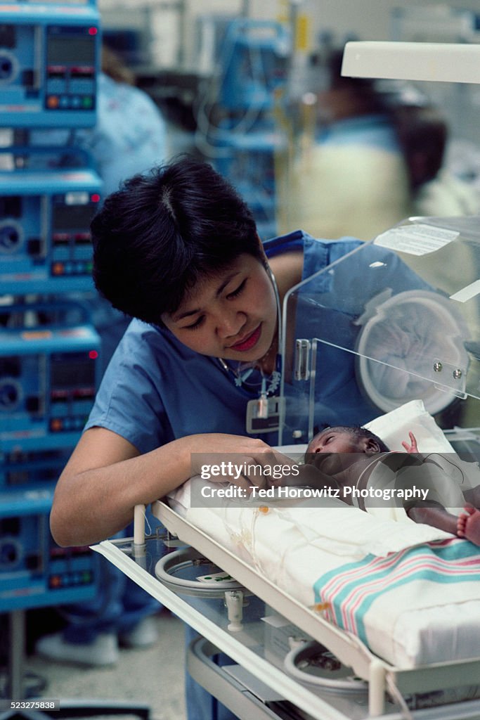Tending to Premature Baby in Neonatal Intensive Care