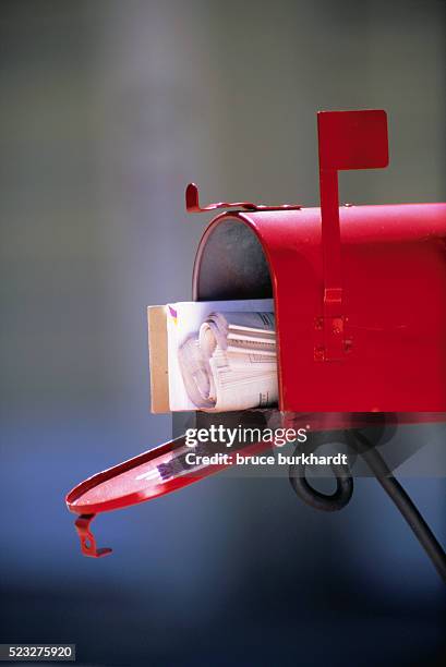 mail inside red mailbox - zeitung briefkasten stock-fotos und bilder
