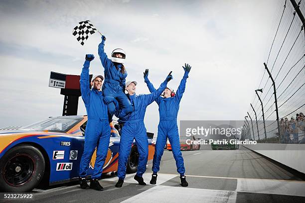 race car drivers winning car race - car racing stock-fotos und bilder