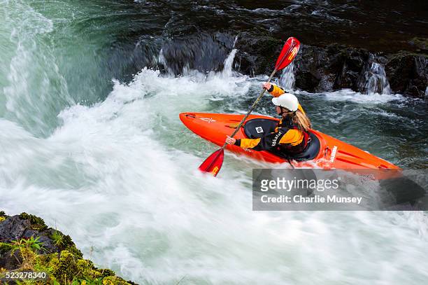 female kayaking in the river - kajak stock-fotos und bilder