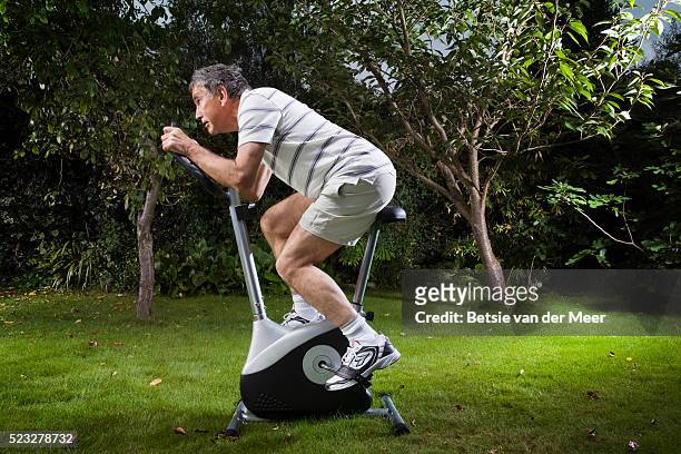 man on exercise bike - white van profile stock pictures, royalty-free photos & images