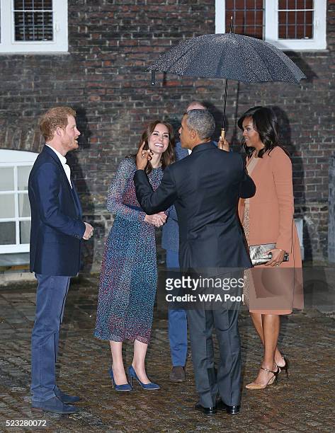 President Barack Obama and First Lady Michelle Obama are greeted by Prince Harry, Prince William, Duke of Cambridge and Catherine, Duchess of...