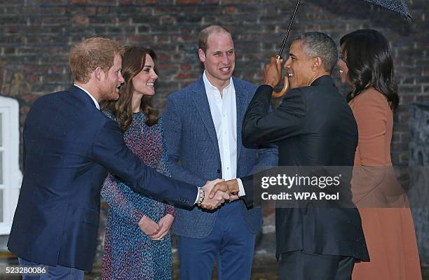 President Barack Obama and First Lady Michelle Obama are greeted by Prince Harry, Prince William, Duke of Cambridge and Catherine, Duchess of...