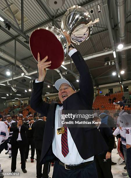 Head coach Don Jackson of Muenchen poses with the trophy after winning the DEL playoffs final game four between Grizzlys Wolfsburg and Red Bull...