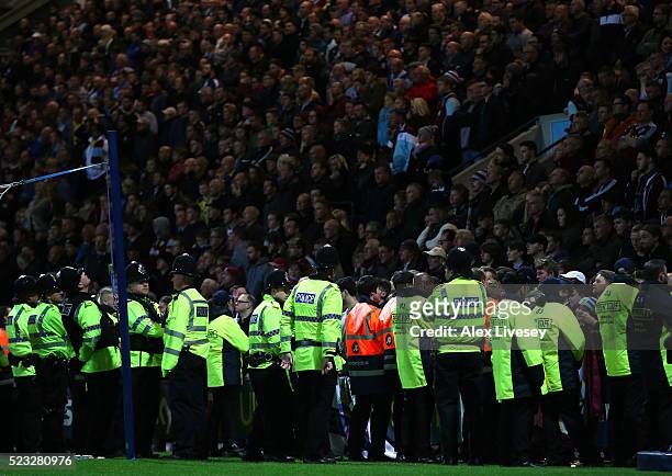 Police and stewards stand in front of the supporters of Burnley during the Sky Bet Championship match between Preston North End and Burnley at...