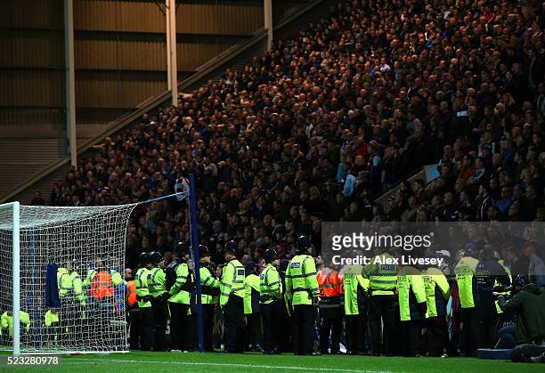 Police and stewards stand in front of the supporters of Burnley during the Sky Bet Championship match between Preston North End and Burnley at...