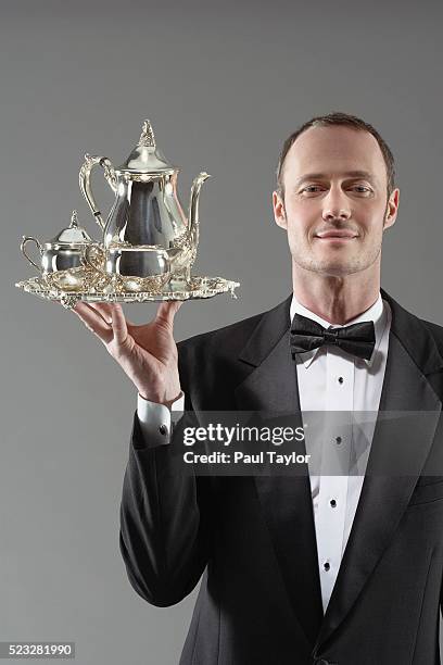 waiter carrying silver tea set - dining presentation food fotografías e imágenes de stock