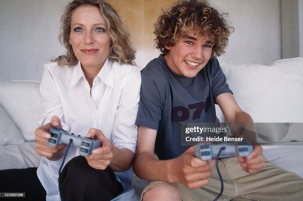 Mother and son playing video games