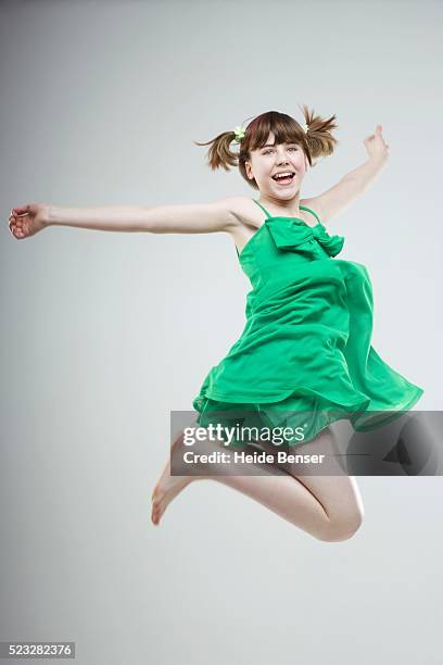 girl jumping for joy - woman isolated full body profile stock pictures, royalty-free photos & images