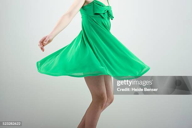 woman spinning - cocktail dress stock pictures, royalty-free photos & images