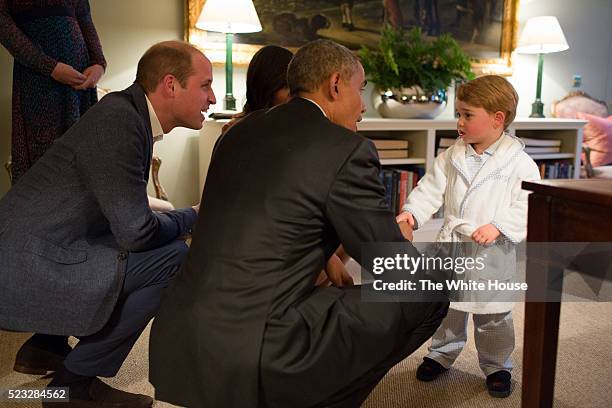 In this handout provided by The White House, President Barack Obama, Prince William, Duke of Cambridge and First Lady Michelle Obama talks with...