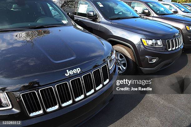 Jeep Grand Cherokee vehicles are seen on a sales lot as Fiat Chrysler Automobiles announced that it is recalling more than 1.1 million cars and SUVs...