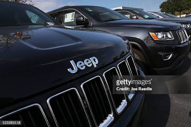 Jeep Grand Cherokee vehicles are seen on a sales lot as Fiat Chrysler Automobiles announced that it is recalling more than 1.1 million cars and SUVs...