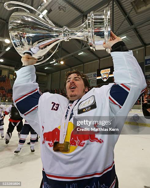 David Leggio of Muenchen poses with the trophy after winning the DEL playoffs final game four between Grizzlys Wolfsburg and Red Bull Muenchen at Eis...