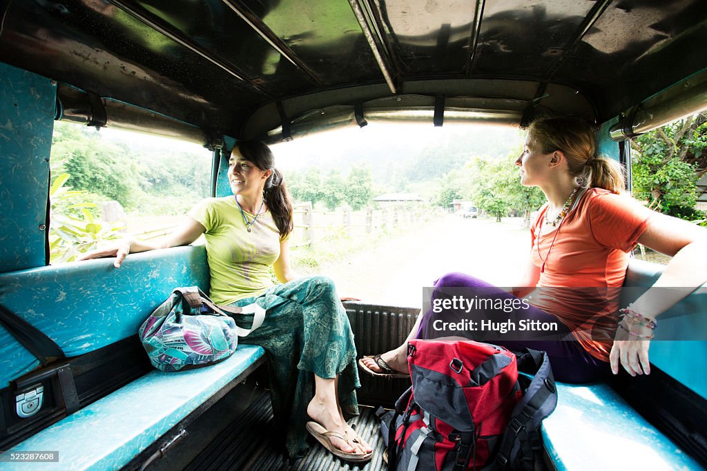 Two women traveling by bus, Chiang Mai, Thailand