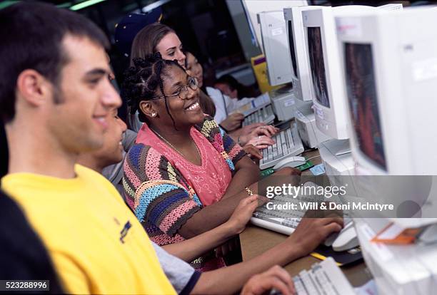 high school students working in a computer lab - 1980 computer fotografías e imágenes de stock