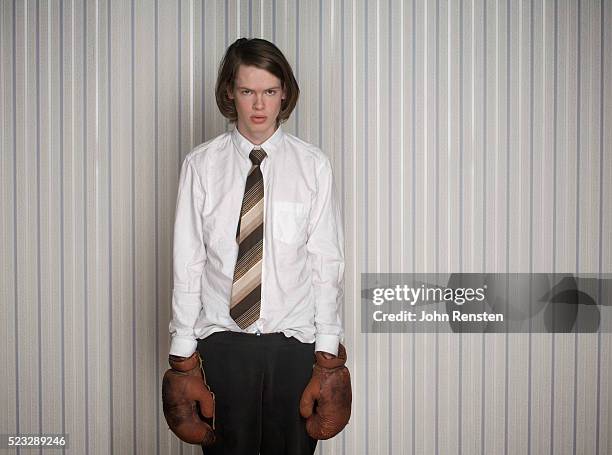 young businessman wearing boxing gloves - tangled hair stock pictures, royalty-free photos & images