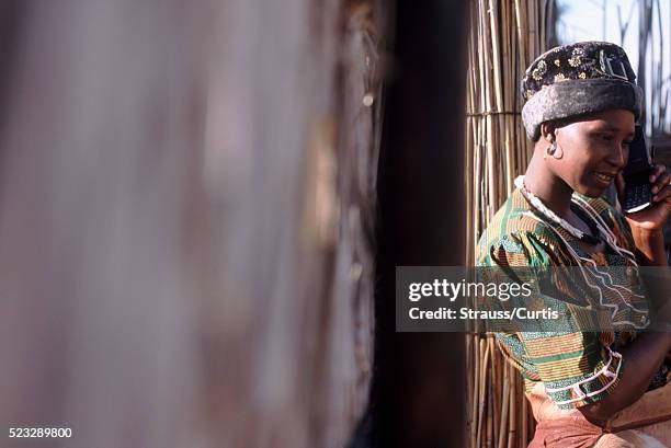 tswana woman using cell phone - botswana - botswana stock pictures, royalty-free photos & images