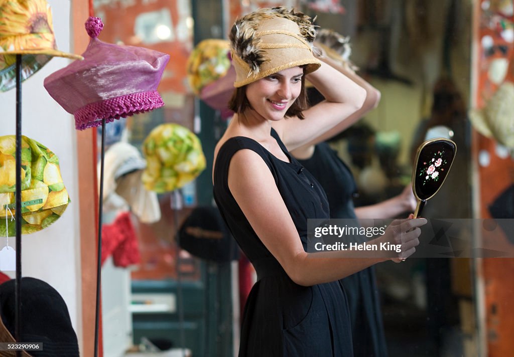 Woman trying on a hat