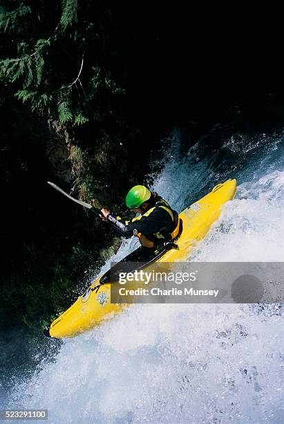 kayaker maneuvering over spirit falls - skamania county stock pictures, royalty-free photos & images