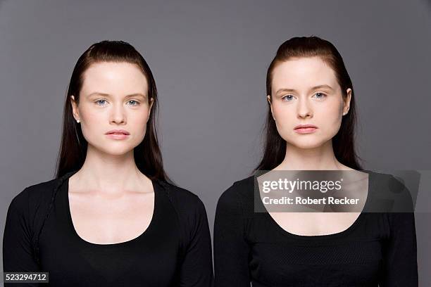 identical twin sisters - twins stock pictures, royalty-free photos & images