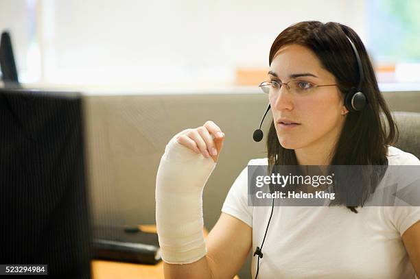 office worker with wrist cast - injured at work stock pictures, royalty-free photos & images