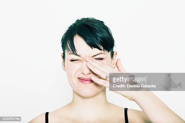 woman rubbing eye - gnugga bildbanksfoton och bilder