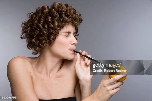 woman drinking lemon juice - straw stock pictures, royalty-free photos & images