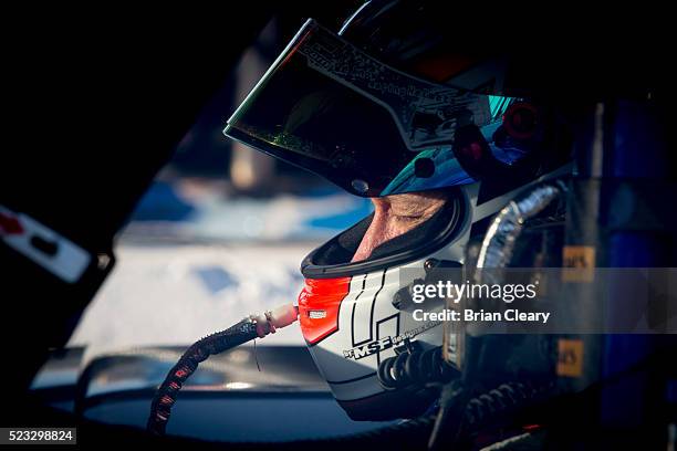 John Pew sits in his race car before the IMSA WeatherTech Series race at Toyota Grand Prix of Long Beach on April 16, 2016 in Long Beach, California.