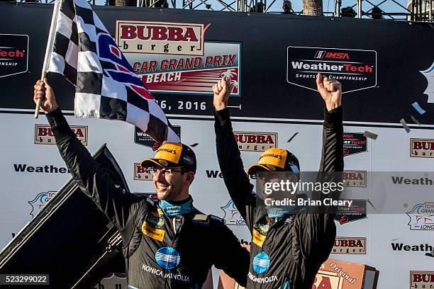 Jordan Taylor, L, and Ricky Taylor celebrate in victory lane after winning the IMSA WeatherTech Series race at Toyota Grand Prix of Long Beach on...