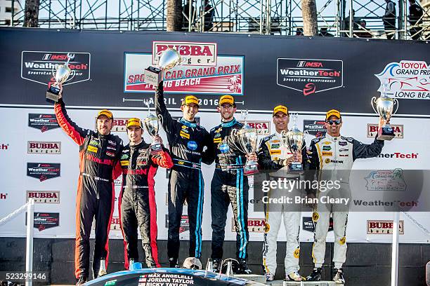 Podium finishers Eric Curran Dane Cameron, Jordan Taylor, Ricky Taylor, Joao Barbosa and Christian Fittipaldi celebrate after the IMSA WeatherTech...