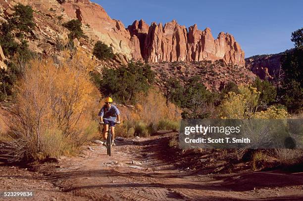 biker at capitol reef national park - capitol reef national park stock pictures, royalty-free photos & images