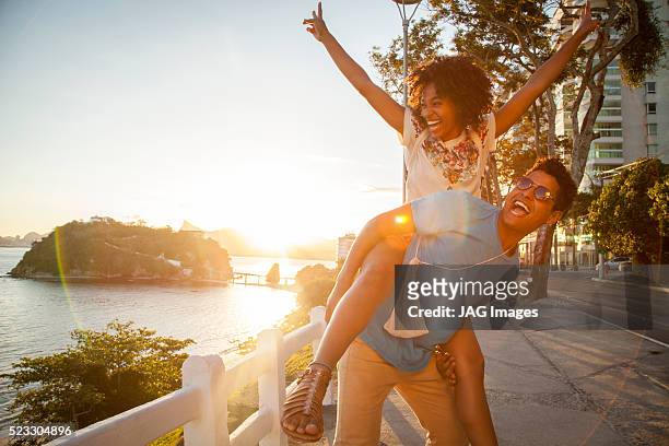 young couple having fun in niteroi, rio de janeiro, brazil - niteroi stock pictures, royalty-free photos & images