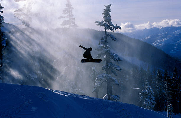 silhouette of snowboarder - snowboarding stock pictures, royalty-free photos & images