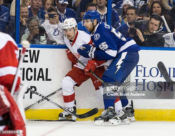 Braydon Coburn of the Tampa Bay Lightning skates against Tomas Tatar of the Detroit Red Wings during the third period of Game Two of the Eastern...