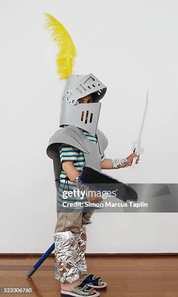 boy playing dress up - knights stock-fotos und bilder