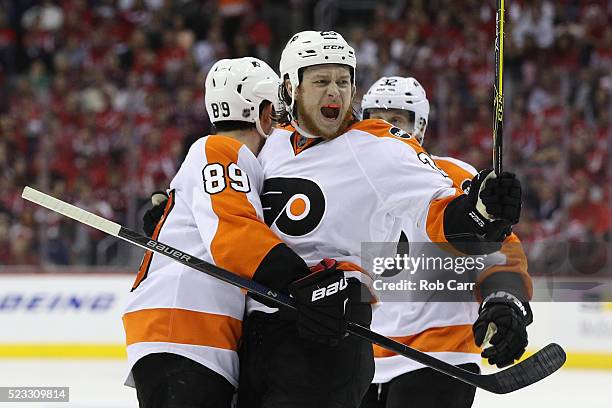 Ryan White of the Philadelphia Flyers celebrates with Sam Gagner after scoring a second period goal in Game Five of the Eastern Conference...