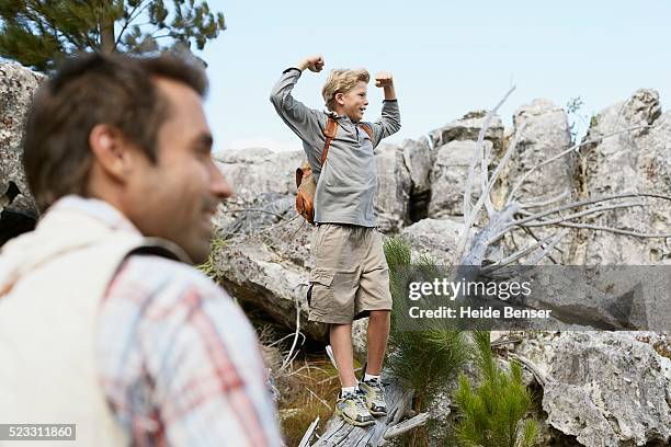 father and son hiking - bermuda shorts stock pictures, royalty-free photos & images