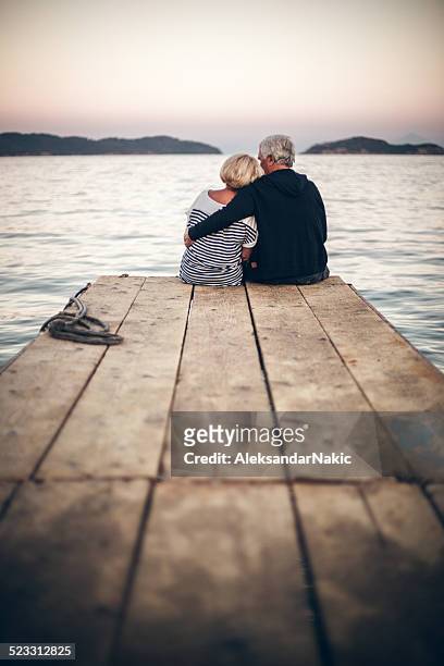 romantics - beach pier stock pictures, royalty-free photos & images