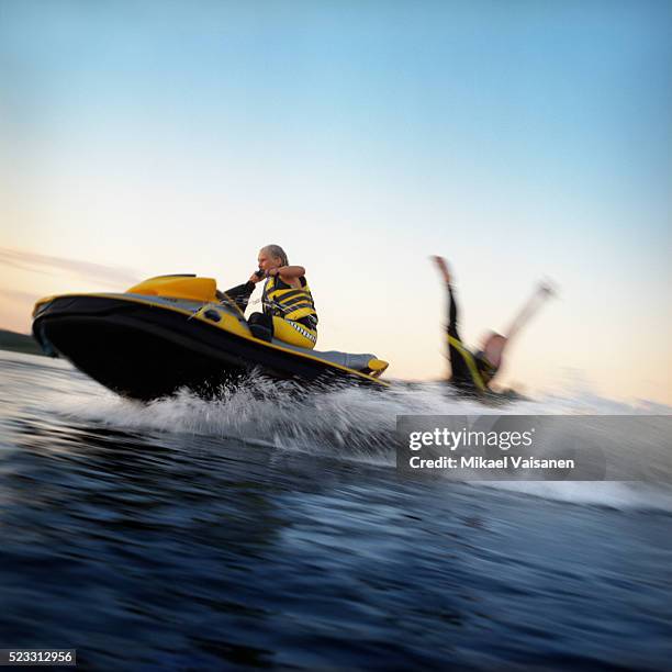 man falling off jet ski - trip hazard stock pictures, royalty-free photos & images