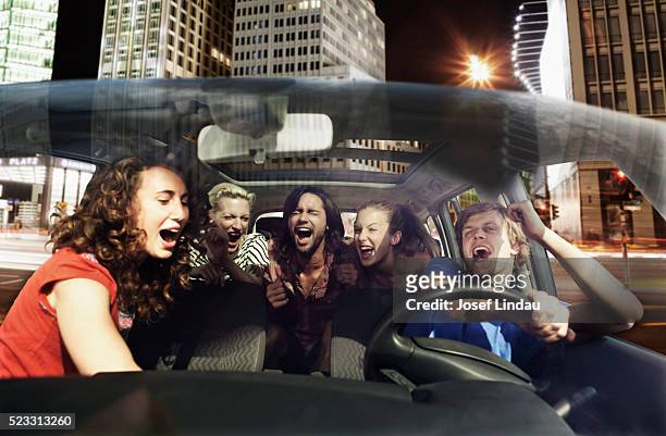 friends singing in a car - singing stock pictures, royalty-free photos & images