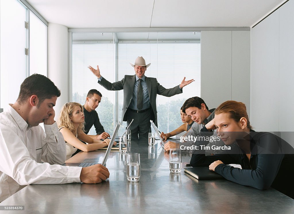Businessman Talking to Bored Staff in Meeting