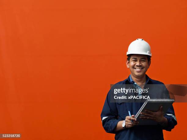 commercial shipping port inspector in malaysia - malaysian people stock pictures, royalty-free photos & images